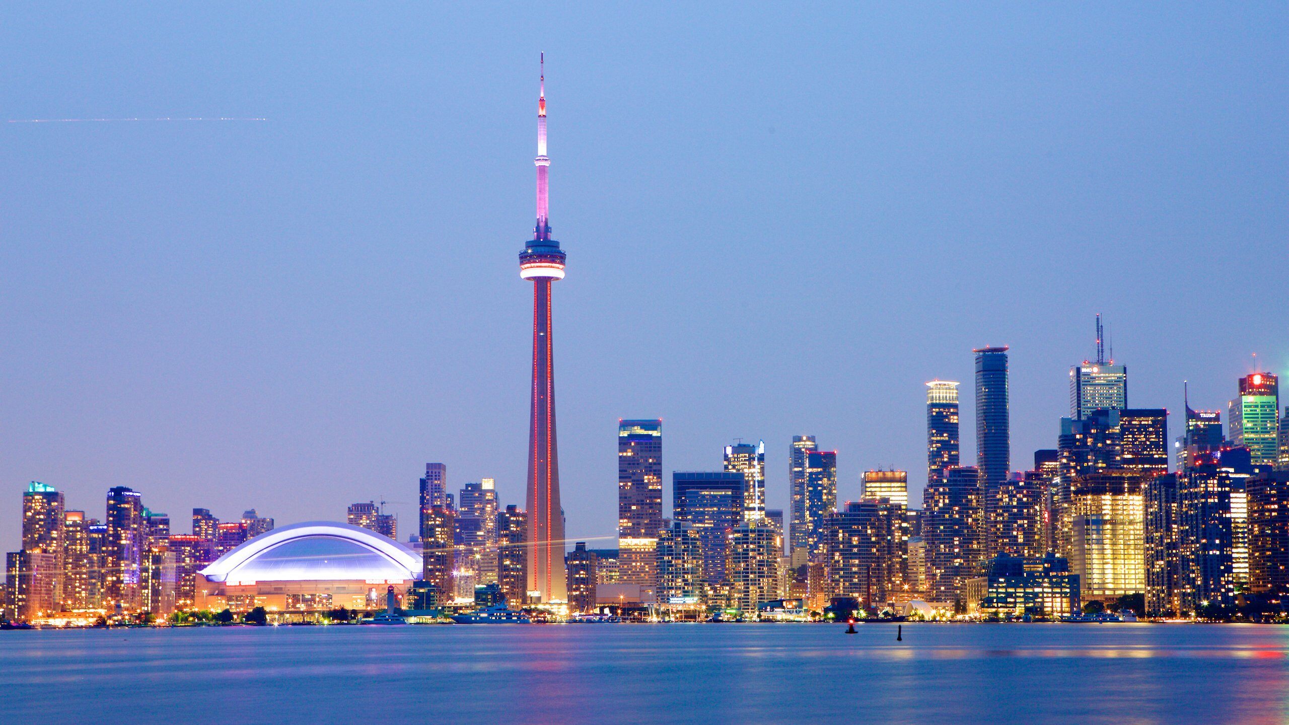 A vibrant city skyline with modern architecture represents potential for overseas students in Canada.