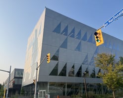 The building of York University School of Continuing Studies with cars passing around it.