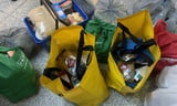 Bunch of bags kept on the floor with food supplies in them