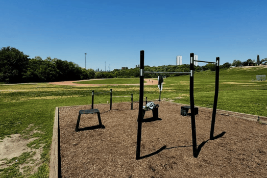 Photo of riverdale park from bar and rining court with the blue sky and green nature.