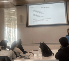 Students attentively listening to the professor in a YorkU SCS classroom as they discuss the upcoming assignment deadline.