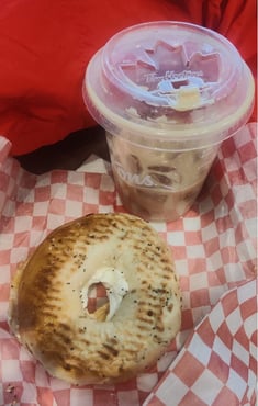 Tim Hortons, Iced coffee and a cream cheese bagel on a red and white food paper