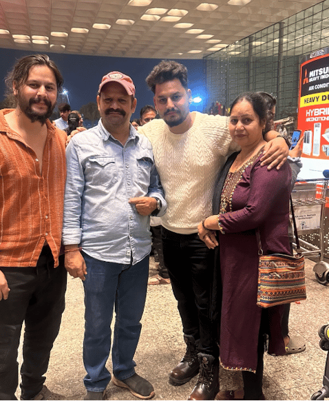 Family saying goodbye at the airport before depaerting from India to Canada