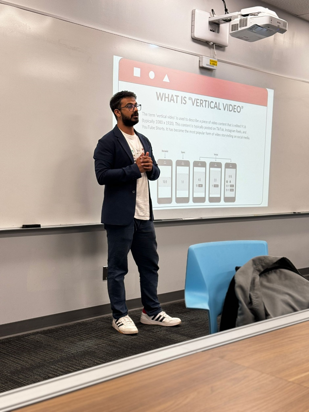 Guest lecturer in a blazer talking about vertical video in class