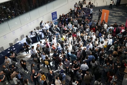 An image showing a group of students connecting at a networking event