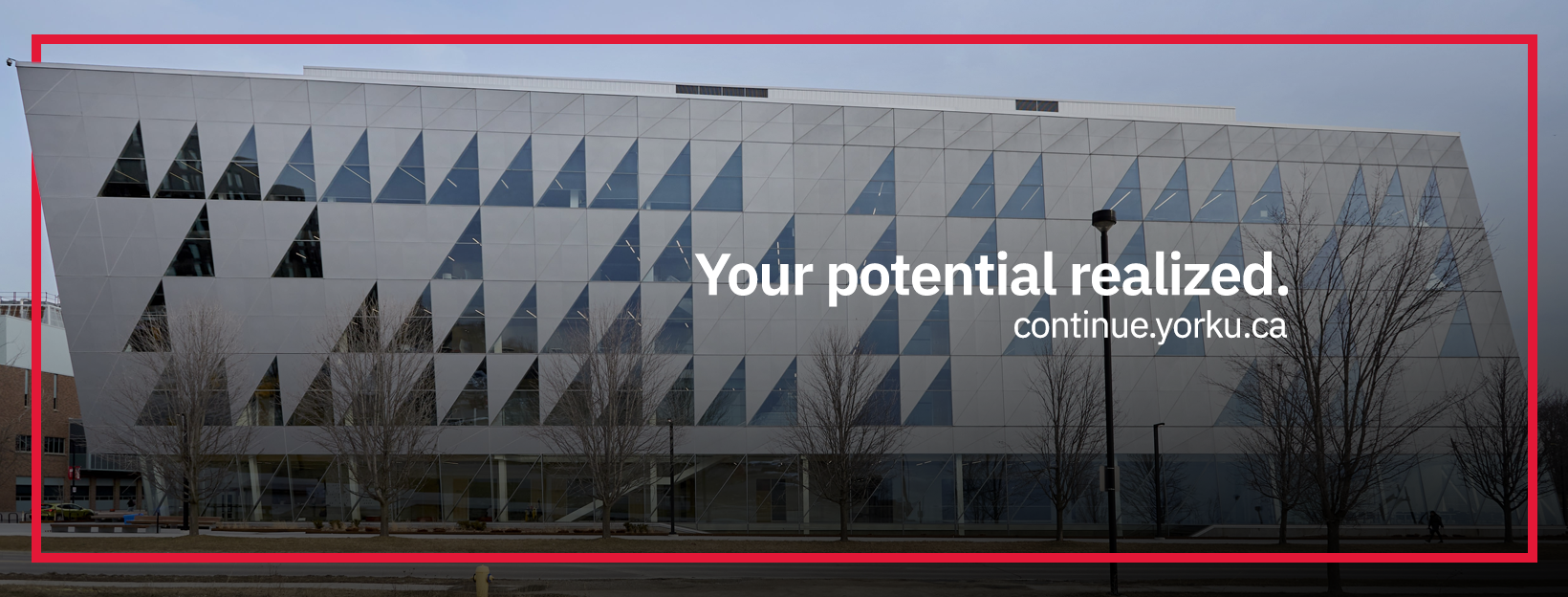 A side view of York School of continuing studies building with a text written on the picture : Your potential realized.