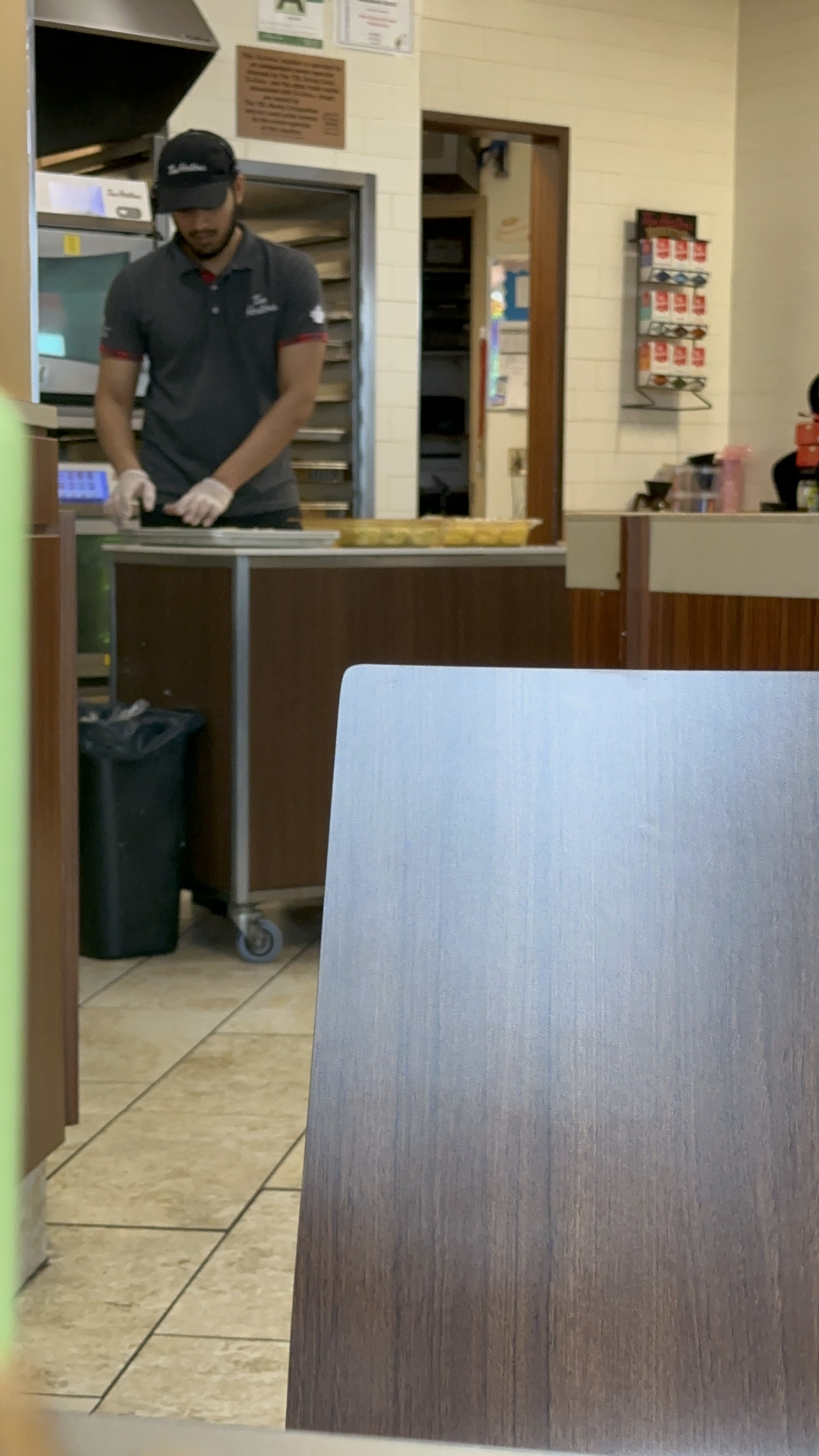A male baking in a cafe kitchen